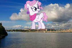 Size: 1600x1065 | Tagged: safe, anonymous editor, artist:cirillaq, edit, raspberry latte, pony, unicorn, g4, clothes, ear piercing, earring, female, finland, giant pony, giantess, glasses, helsinki, highrise ponies, irl, jewelry, macro, mare, photo, piercing, ponies in real life, raised hoof, scarf, solo, story included