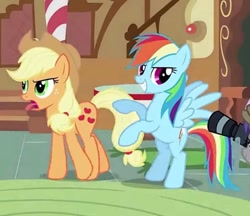 Size: 1125x973 | Tagged: safe, screencap, applejack, rainbow dash, earth pony, pegasus, pony, g4, the mysterious mare do well, camera, cropped, open mouth, posing for photo, smiling, sugarcube corner, tongue out