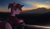 Size: 2200x1254 | Tagged: safe, artist:uliovka, oc, oc only, oc:basura, pony, unicorn, cellphone, city, clothes, glasses, hoodie, horn, looking at you, male, mountain, phone, round glasses, scenery, smartphone, smiling, smiling at you, solo, stallion, sunset, unicorn oc