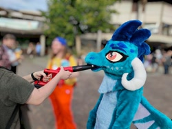 Size: 2000x1500 | Tagged: safe, princess ember, dragon, human, anthro, galacon, g4, blurry background, clothes, convention, cosplay, costume, cute, female, furry, fursuit, gloves, indoors, irl, irl human, leaf blower, orange eyes, photo, photography, ponysuit, solo