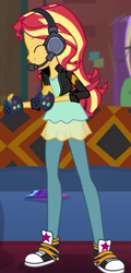Size: 340x709 | Tagged: safe, screencap, sunset shimmer, human, equestria girls, g4, game stream, spoiler:eqg series (season 2), clothes, console, couch, cropped, cute, gamer sunset, headphones, jacket, leather, leather jacket, pants, shimmerbetes, smiling, smiling at someone, solo, sunset's apartment, trainers