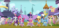 Size: 1287x621 | Tagged: safe, screencap, amber waves, applejack, berry punch, berryshine, bon bon, cherry berry, cloudchaser, dizzy twister, doctor whooves, flitter, fluttershy, lightning bolt, minuette, noi, orange swirl, pinkie pie, rainbow dash, rarity, ruby pinch, spike, sunshower raindrops, sweetie drops, time turner, twilight sparkle, twinkleshine, white lightning, written script, alicorn, pony, g4, magical mystery cure, background pony, big crown thingy, canterlot, clothes, coronation dress, crowd, crown, dress, element of magic, floral head wreath, flower, hat, jewelry, life in equestria, mane seven, mane six, regalia, tiara, twilight sparkle (alicorn)