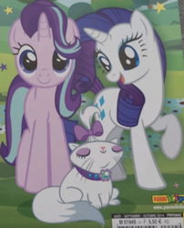 Size: 1074x1332 | Tagged: safe, opalescence, rarity, starlight glimmer, cat, pony, unicorn, g4, barcode, cute, duo, french, front view, hair flip, hair over one eye, looking at you, magazine, staring into your soul