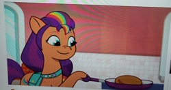Size: 3000x1589 | Tagged: safe, screencap, sunny starscout, earth pony, pony, g5, my little pony: tell your tale, sunny-day dinners, spoiler:g5, spoiler:my little pony: tell your tale, spoiler:tyts01e10, bag, crystal brighthouse, cute, food, mane stripe sunny, pancakes, photo, picture of a screen, saddle bag, sunnybetes