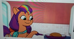 Size: 3000x1589 | Tagged: safe, screencap, sunny starscout, earth pony, pony, g5, my little pony: tell your tale, sunny-day dinners, spoiler:g5, spoiler:my little pony: tell your tale, bag, crystal brighthouse, cute, food, mane stripe sunny, pancakes, photo, picture of a screen, saddle bag, sunnybetes