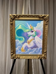 Size: 1536x2048 | Tagged: safe, artist:dandy, princess celestia, alicorn, pony, mare fair, acrylic painting, cloud, crown, eyeshadow, female, framed picture, hair over one eye, horn, jewelry, looking at you, makeup, mare, mare gallery, painting, photo, raised hoof, regalia, sky, smiling, solo, traditional art, wings