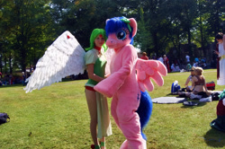 Size: 1920x1278 | Tagged: safe, artist:atalonthedeer, firefly, human, g1, 2012, connichi, duo focus, fursuit, grass, irl, irl human, outdoors, photo, ponysuit, solo