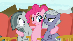 Size: 1920x1080 | Tagged: safe, screencap, limestone pie, marble pie, pinkie pie, earth pony, pony, g4, my little pony: friendship is magic, rock solid friendship, season 7, annoyed, bipedal, discovery family logo, female, hind legs, hug, looking at each other, looking at someone, mare, shrunken pupils, siblings, sisters, sitting, trio, trio female