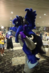 Size: 640x960 | Tagged: safe, artist:atalonthedeer, artist:judhudson, princess luna, oc, oc:echo, alicorn, bat pony, human, g4, bat pony oc, convention, duo focus, fursuit, indoors, irl, irl human, photo, ponysuit, riding on back, side view, spread wings, wings