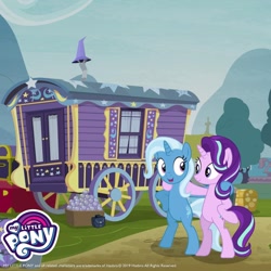 Size: 1080x1080 | Tagged: safe, gameloft, starlight glimmer, trixie, pony, unicorn, g4, bipedal, duo, duo female, female, horn, looking at each other, looking at someone, mare, my little pony logo, outdoors, trixie's wagon, wagon