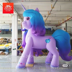 Size: 800x800 | Tagged: safe, izzy moonbow, human, inflatable pony, pony, unicorn, g5, 360 inflatable, female, horn, indoors, inflatable, inflatable unicorn, irl, irl human, izzy is tol, logo, mare, matte, opaque inflatable, photo, shiny floor, side view, solo, standing, watermark