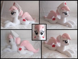 Size: 2198x1654 | Tagged: safe, artist:littlefairyswonders, nurse redheart, earth pony, pony, g4, bed, bedroom eyes, female, irl, looking at you, lying down, multiple views, photo, plushie, prone, solo