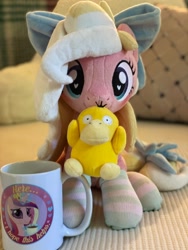 Size: 1536x2048 | Tagged: safe, artist:emberslament, artist:meplushyou, princess cadance, oc, oc:bay breeze, pony, psyduck, g4, bow, clothes, coffee mug, female, hair bow, irl, mare, mug, photo, plushie, pokémon, socks, solo, striped socks