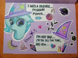 Size: 4160x3120 | Tagged: safe, artist:mashee, trixie, pony, unicorn, g4, card, horn, looking at you, looking down, photo, purple background, sad, simple background, stars, sticker, traditional art, trixie day