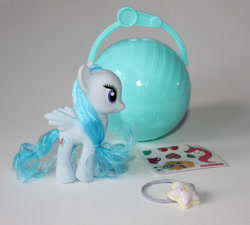 Size: 1000x898 | Tagged: safe, pegasus, pony, bootleg, female, irl, mare, not rainbow dash, not rarity, photo, rainbow 彩虹小马, solo, sticker, toy