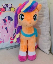 Size: 1437x1723 | Tagged: safe, sunny starscout, twilight sparkle, alicorn, earth pony, pony, g4, g5, official, bag, coat markings, cross-eyed, hasbro city, looking forward, mane stripe sunny, merchandise, pillow, plushie, quadrupedal, smiling, socks (coat markings), spread wings, standing, sunny and her heroine, sunny's bag, twilight sparkle (alicorn), unshorn fetlocks, wings