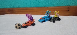 Size: 4160x1920 | Tagged: safe, artist:tom artista, fluttershy, rainbow dash, twilight sparkle, alicorn, pegasus, pony, g4, ball, car, crossover, duo, duo female, female, hot wheels, indoors, kinder egg, quad bike, rocket league, tank (vehicle), toy, twilight sparkle (alicorn)