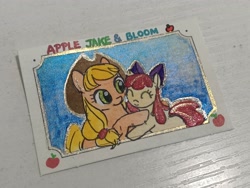 Size: 4000x3000 | Tagged: safe, artist:foluolunsadedengta, apple bloom, applejack, earth pony, pony, apple, apple sisters, bow, eyes closed, female, filly, foal, food, hair bow, hat, hug, mare, passepartout, photo, siblings, sisters, sky background, smiling, stamp, text, traditional art