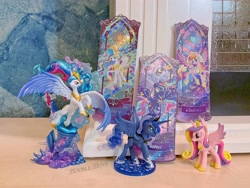 Size: 4380x3285 | Tagged: safe, kotobukiya, princess cadance, princess celestia, princess luna, pony, g4, official, belly, concave belly, figure, funko, irl, kayou, large wings, merchandise, music notes, photo, rainbow power, rainbow power-ified, raised hoof, search fun, side view, slender, spread wings, statue, thin, ticket, toy, wings