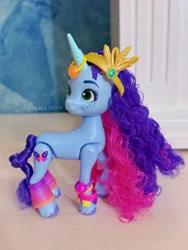 Size: 3201x4268 | Tagged: safe, misty brightdawn, unicorn, g5, official, accessory, bracelet, brushable, eyeshadow, freckles, friendship bracelet, horn, irl, jewelry, looking back, makeup, merchandise, photo, solo, standing, tiara, toy