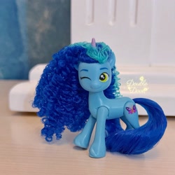 Size: 2252x2252 | Tagged: safe, misty brightdawn, pony, unicorn, g5, official, brushable, dinosaw, horn, irl, long mane, merchandise, one eye closed, photo, solo, toy, wink