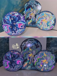 Size: 3442x4590 | Tagged: safe, princess celestia, princess luna, g4, official, badge, card, crystal, glow in the dark, irl, merchandise, photo, rainbow power, rainbow power-ified, raised hoof, spread wings, stained glass, wings