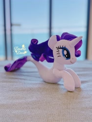 Size: 3024x4032 | Tagged: safe, rarity, seapony (g4), unicorn, g4, bedroom, horn, indoors, irl, ocean, photo, plushie, pony plushie, seaponified, seapony rarity, side view, solo, species swap, water