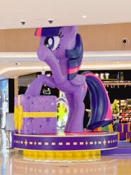 Size: 1169x1559 | Tagged: safe, twilight sparkle, alicorn, pony, g4, official, cutie mark, indoors, irl, photo, present, shopping mall, side view, solo, standing on two hooves, statue, twilight sparkle (alicorn), waving