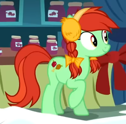 Size: 409x402 | Tagged: safe, screencap, candy apples, earth pony, pony, g4, my little pony best gift ever, my little pony: friendship is magic, apple family member, background pony, clothes, cropped, earmuffs, female, mare, raised hoof, solo, winter outfit