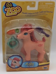 Size: 1935x2560 | Tagged: safe, deer, bootleg, carrot, comb, female, food, irl, lanard, lanard pet zoo, misty the deer, name, packaging, photo, smiling, solo, text, toy