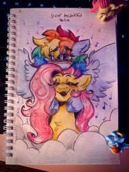 Size: 3024x4032 | Tagged: safe, artist:yumkandie, fluttershy, rainbow dash, pegasus, pony, g4, blushing, cloud, cuddling, duo, ear piercing, earring, eyebrows, eyebrows visible through hair, eyes closed, female, figurine, floating heart, heart, hug, jewelry, lesbian, love, lying down, notes, on a cloud, pencil drawing, piercing, prone, ship:flutterdash, shipping, smiling, snuggling, sun, traditional art, wings