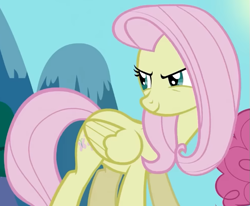 Size: 683x562 | Tagged: safe, screencap, fluttershy, pegasus, pony, g4, season 2, the return of harmony, cropped, discorded, female, flutterbitch, fluttercruel, folded wings, looking back, mare, offscreen character, smiling, solo, standing, wings