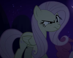 Size: 750x594 | Tagged: safe, screencap, fluttershy, pegasus, pony, g4, season 2, the return of harmony, cropped, discorded, female, flutterbitch, fluttercruel, folded wings, mare, night, offscreen character, solo, squint, wings
