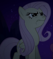 Size: 595x654 | Tagged: safe, screencap, fluttershy, pegasus, pony, g4, season 2, the return of harmony, cropped, discorded, female, flutterbitch, fluttercruel, folded wings, grimace, mare, night, solo, squint, wings