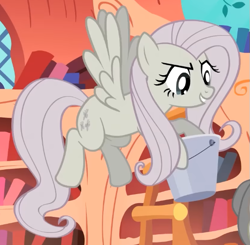 Size: 579x567 | Tagged: safe, screencap, fluttershy, pegasus, pony, g4, season 2, the return of harmony, bucket, cropped, discorded, evil grin, female, flutterbitch, fluttercruel, flying, golden oaks library, grin, hoof hold, mare, smiling, solo