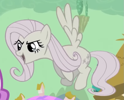 Size: 573x462 | Tagged: safe, screencap, fluttershy, pegasus, pony, g4, season 2, the return of harmony, cropped, discorded, female, flutterbitch, fluttercruel, flying, looking at someone, mare, offscreen character, open mouth, open smile, smiling, solo