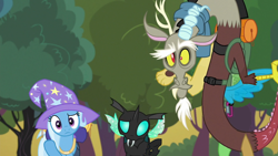 Size: 1280x720 | Tagged: safe, edit, edited screencap, editor:incredibubbleirishguy, screencap, discord, thorax, trixie, changeling, draconequus, unicorn, g4, to where and back again, backpack, bush, clothes, confused, dunno, hat, shrug, tree, trio, trixie's hat