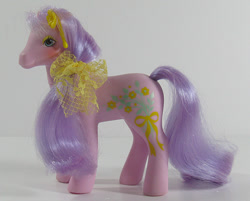 Size: 746x600 | Tagged: safe, spring song, earth pony, pony, g1, bow, ear piercing, earring, female, hair bow, irl, jewelry, photo, piercing, solo, standing, sweetheart sister ponies