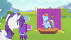 Size: 1920x1080 | Tagged: safe, screencap, rainbow dash, rarity, butterfly, monarch butterfly, pegasus, pony, unicorn, g4, may the best pet win, 1080p, ^^, backdrop, bush, butt, camera, clothes, cute, dashabetes, day, desaturated, duo, eyes closed, female, grass, mare, outdoors, plot, posing for photo, raribetes, rearity, scarf, skis, smiling, striped scarf, tree