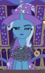 Size: 225x365 | Tagged: safe, screencap, trixie, g4, uncommon bond, cape, chains, clothes, cropped, hat, lock, solo, trixie's cape, trixie's hat