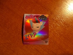 Size: 1024x768 | Tagged: safe, zipp storm, pegasus, pony, g5, my little pony: a new generation, official, bolt, indonesian, irl, merchandise, photo, shiny, smiling, smirk, sticker