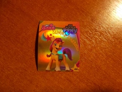 Size: 1024x768 | Tagged: safe, sunny starscout, earth pony, g5, my little pony: a new generation, official, 3d, indonesian, logo, looking at you, merchandise, photo, shiny, standing, stars, sticker