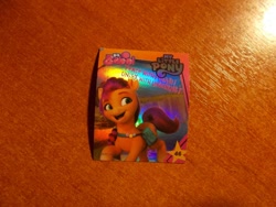 Size: 1024x768 | Tagged: safe, sunny starscout, earth pony, g5, my little pony: a new generation, official, 3d, indonesian, logo, looking away, maretime bay, merchandise, photo, shiny, slogan, smiling, sticker