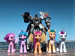 Size: 1032x774 | Tagged: safe, artist:dingopatagonico, hitch trailblazer, izzy moonbow, pipp petals, sunny starscout, zipp storm, alicorn, earth pony, pegasus, unicorn, g5, gundam, gundam wing, horn, photo, serpent mobile suit, toy