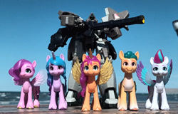 Size: 1116x716 | Tagged: safe, artist:dingopatagonico, hitch trailblazer, izzy moonbow, pipp petals, sunny starscout, zipp storm, alicorn, earth pony, pegasus, unicorn, g5, gundam, gundam wing, horn, photo, serpent mobile suit, toy