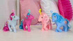 Size: 1000x563 | Tagged: safe, mistyglow, pearlshine, starswirl, swirlabout, earth pony, g1, 40th anniversary, basic fun!, fairy brights, fancy swirl ponies, female, mare, merchandise, photo, raised hoof, smiling, the bridge direct, toy