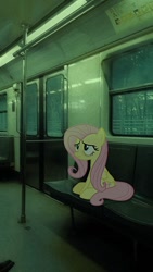 Size: 564x1002 | Tagged: safe, artist:hionazzz, part of a set, fluttershy, pegasus, pony, g4, background human, bags under eyes, bench, depressed, female, green background, irl, looking up, mare, photo, photography, ponies in real life, public transportation, real life background, simple background, sitting, solo, stain, subway, train