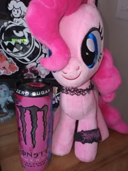 Size: 712x949 | Tagged: safe, pinkie pie, earth pony, pony, g4, blue eyes, bracelet, choker, drink, energy drink, front facing, front view, hair over one eye, irl, jewelry, light switch, monster energy, photo, pink coat, pink mane, plushie, pony plushie, solo, sticker, tumblr, wooden table