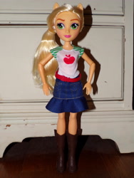 Size: 3456x4608 | Tagged: safe, applejack, equestria girls, g4, arms, belt, boots, clothes, collar, denim skirt, doll, eyeshadow, freckles, hand, happy, hatless, legs, lipstick, long hair, makeup, missing accessory, photo, ponytail, shadow, shirt, shoes, short sleeves, skirt, smiling, standing, t-shirt, toy, wall