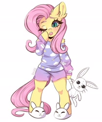 Size: 1710x2048 | Tagged: safe, artist:in4ri_, fluttershy, pegasus, pony, semi-anthro, g4, blushing, bunny plushie, bunny slippers, clothes, cloud pattern, colored eyebrows, cute, doll, ear fluff, female, mare, one eye closed, pajamas, plushie, shorts, shoulder fluff, shyabetes, simple background, sleepy, slippers, solo, standing, toy, white background, yawn